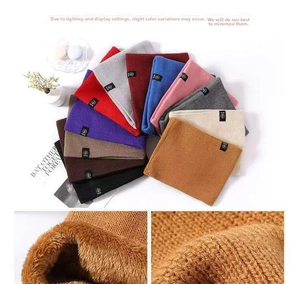 Close-up of thick fleece lining and various colors of knitted winter neck warmers