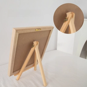Detail of wooden letter board back with adjustable tripod stand and sawtooth wall hanger