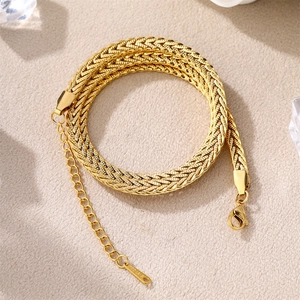Golden woven stainless steel bracelet with lobster clasp and adjustable extension chain