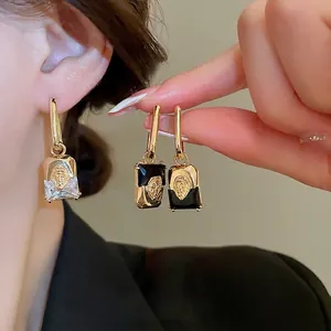Vintage gold plated geometric lion head earrings with rectangular crystal stones