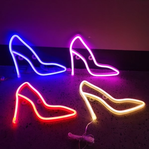 Detail of high heel LED neon signs in blue, pink, red and warm white colors