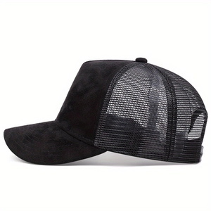 Detail view of black trucker cap featuring premium faux suede front and breathable mesh