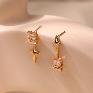 Elegant 18K gold plated star earrings with square zircon stones on a beige model