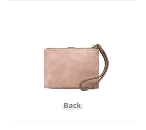 Back view of a dusty rose matte leather small wallet with a matching wrist strap