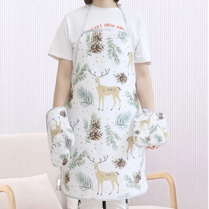 Detailed Christmas kitchen set featuring reindeer patterns on apron and oven mitts