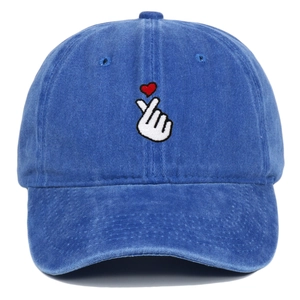 Detailed view of heart finger embroidery and washed cotton fabric on the baseball cap