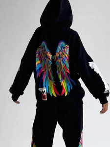 Oversized black hoodie for women featuring a vibrant colorful wing print on the back