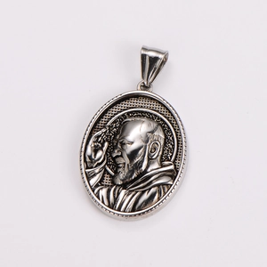 Close-up of silver oval pendant featuring a vintage engraved portrait on grid texture