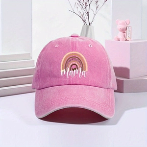 Detailed macro view of the printed rainbow Mama logo on a washed pink cotton baseball cap
