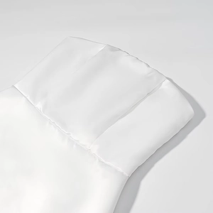 Detailed close-up of a white strapless top with smooth cotton-linen blend fabric texture