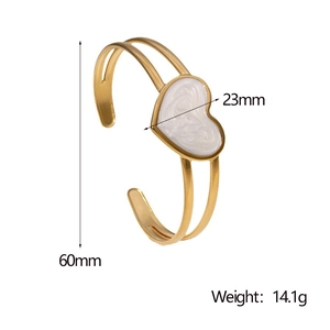 Detail showing 60mm diameter and 23mm heart charm of the gold-plated adjustable bangle