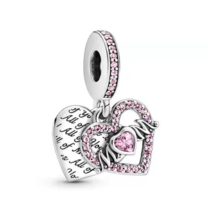 Detail of silver heart charm with pink gemstone, Mom engraving and back verse