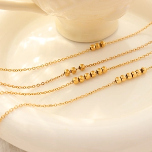 Elegant 18K gold plated beaded anklet set featuring minimalist layered metal chain designs