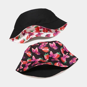 Reversible bucket hat with strawberry and butterfly prints on breathable canvas fabric
