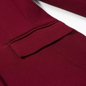 Close-up of wine red blazer pocket flap showing premium fabric texture and neat stitching