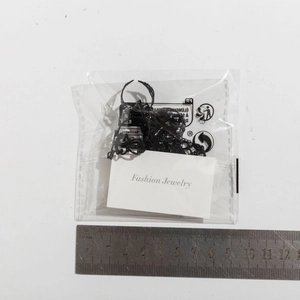 Detailed view of punk gothic black lace-style hollow bracelet rings in retail packaging