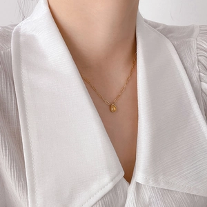 18K gold plated titanium necklace featuring a pear-shaped yellow zircon pendant