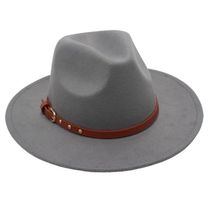 Detail of grey wool felt fedora featuring a brown leather band and gold buckle accent