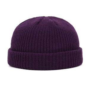 Detailed close-up of the purple knit beanie cap showing ribbed texture and rolled cuff