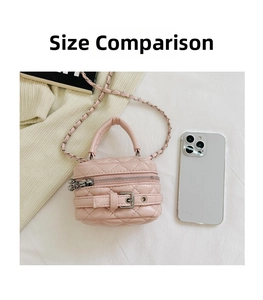 Detailed view of pink quilted mini bag with silver chain strap and phone for scale