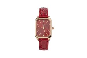 Detail view of burgundy faux leather strap and golden rectangular rhinestone dial