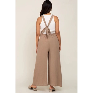 Detail of maternity wide-leg pants in beige linen texture with back tie-up design