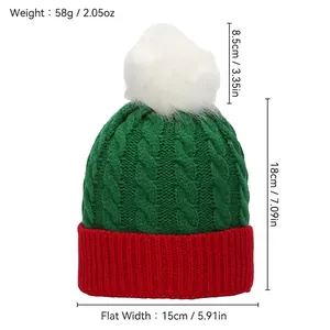 Knitted Christmas hat for children with red, green, and white patterns and fluffy pompom