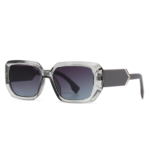 Modern square sunglasses with transparent gray frames and dark gradient lenses