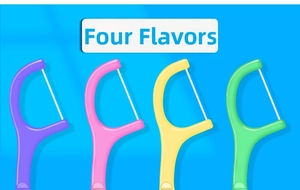 Detailed view of four colorful dental floss picks in purple pink yellow and green colors