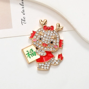Macro shot of gold dragon accessory with white rhinestones and a green Fu character