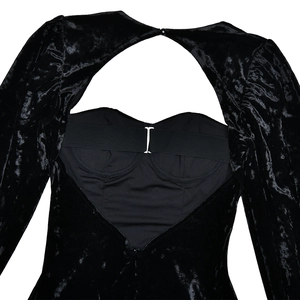 Close-up of open back velvet mini dress with lace-up cuff and hook-and-eye closure