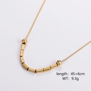 Detail of gold necklace with geometric block pendant and length spec 45+6cm