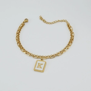 Gold double-layer paperclip chain bracelet with a square letter K pendant and lobster clasp