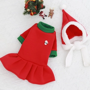Christmas pet outfit with red green pleated skirt and Santa hat on lace background
