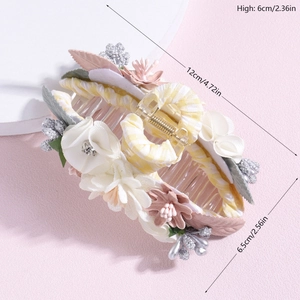 Floral shark hair clip with pink and white daisies and yellow checkered fabric ribbons