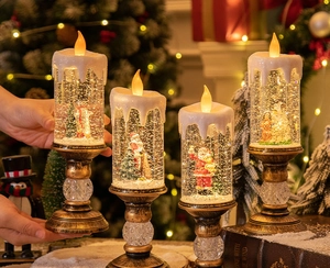 Christmas LED water globe candle lights with Santa and snowman scenes on a cozy table