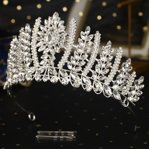 Macro shot of luxury bridal tiara with sparkling crystal leaves on black reflection