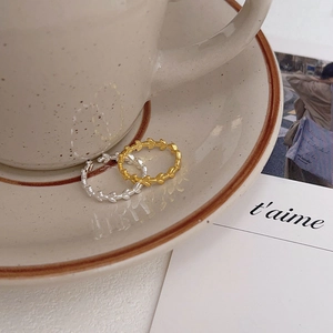 Exquisite 925 sterling silver leaf rings in gold and silver finish on ceramic saucer
