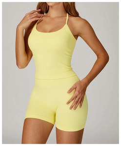 Detailed texture of seamless ribbed yoga set featuring strappy top and high-waist shorts