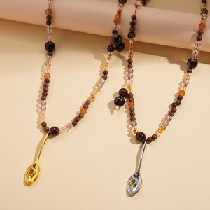 Ethnic style sweater chain featuring acrylic wood beads and a spoon pendant with gemstone