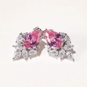 Macro shot of pink pear-cut crystals and marquise stones on silver earring base