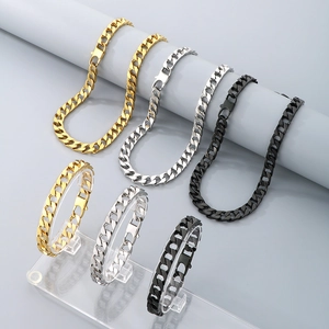 Close-up of hip-hop cuban chain necklaces and bracelets in gold, silver, and black finish