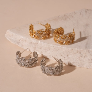 Gold and silver C-shaped hoop earrings with shimmering cubic zirconia micro-pave setting