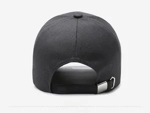 Close-up of the metal buckle adjustment strap on the back of a dark gray cotton baseball cap