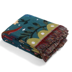 Bohemian outdoor picnic blanket with floral jacquard weave and colorful tassels