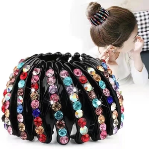 Macro detail of bird nest hair clip with colorful rhinestones and velvet finish