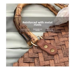 Detail of bamboo handles and metallic rivets on a vintage large woven tote bag