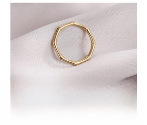 Macro detail of bamboo texture on gold plated titanium steel ring for women