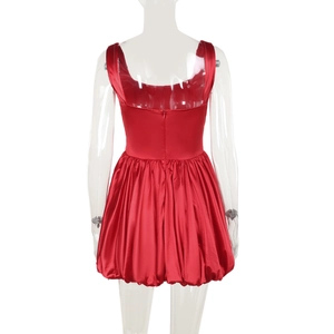 Rear view of red satin mini dress featuring a bubble hem and deep U-shaped back design