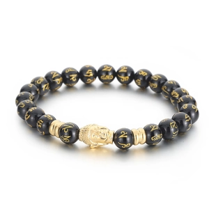 Tiger eye and obsidian beaded bracelet featuring a gold Buddha head and mantra carvings